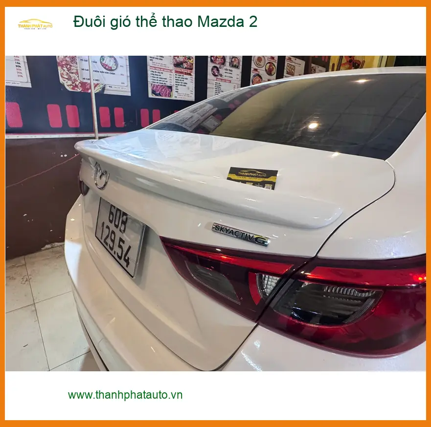 Chị Hoa lắp đuôi gió thể thao cho Mazda 2 tại Quận 5 tăng vẻ mạnh mẽ ảnh thực tế 4